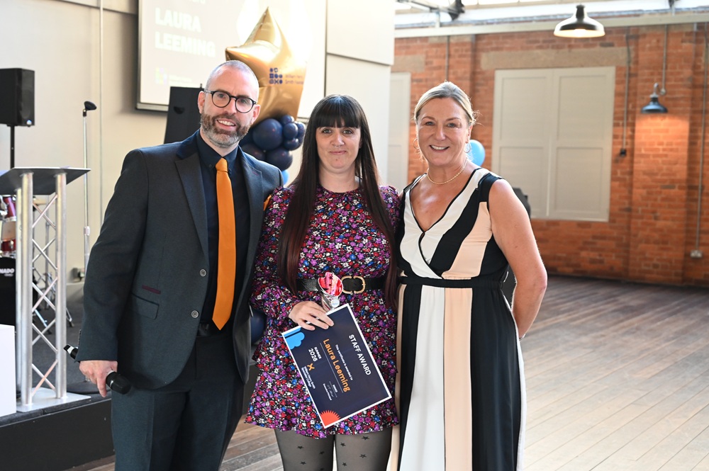 Simon Cotton (left), Laura Leeming (middle) and Sonia Stewart (right) present staff member of the year award