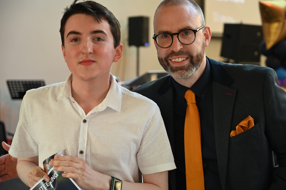Volunteering award presented to student by Simon Cotton, Head of COllege