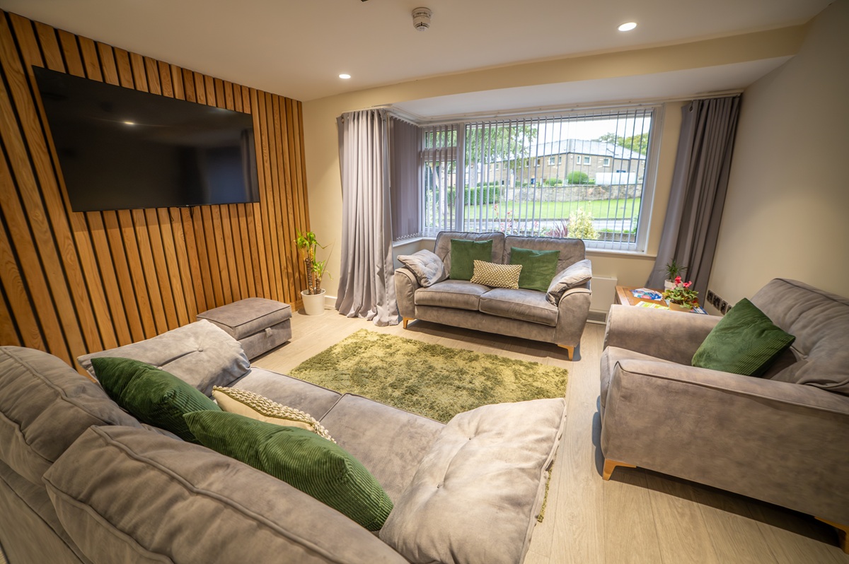 neutral lounge area with tv