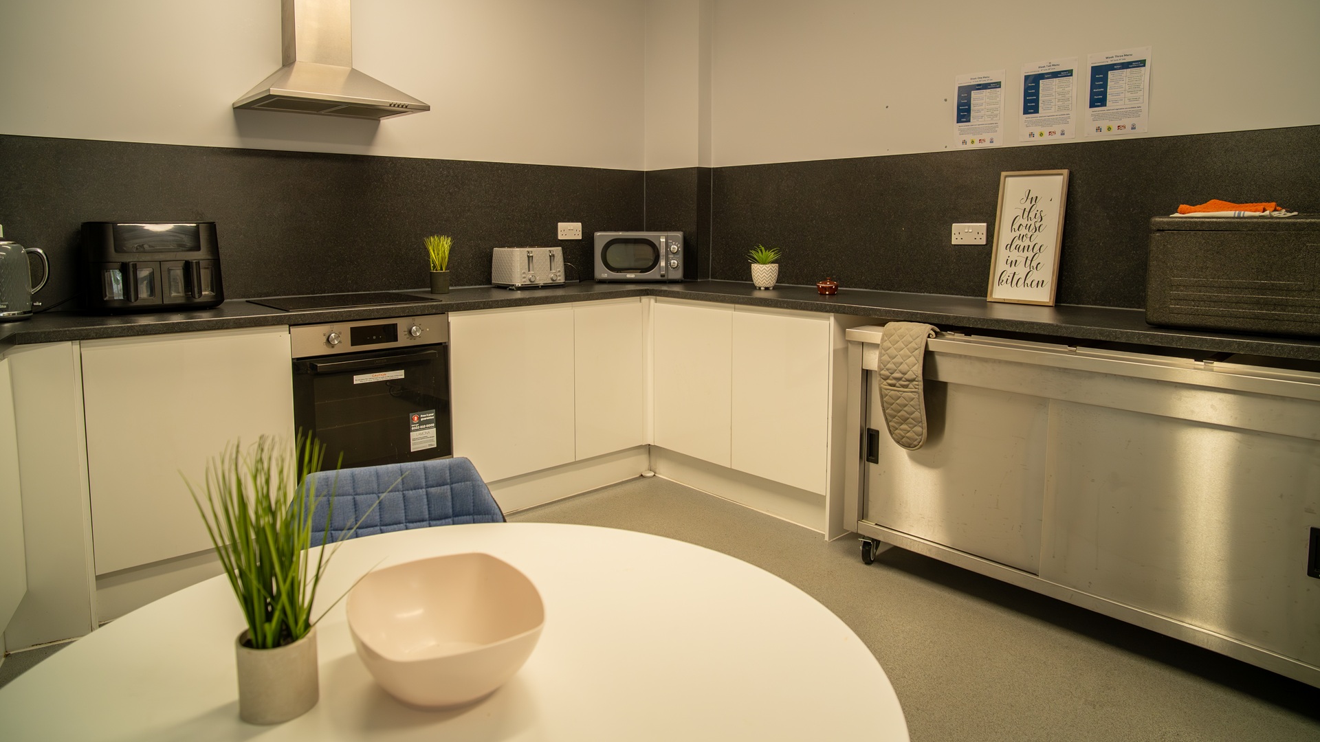 Communal kitchen space with toaster and ovens